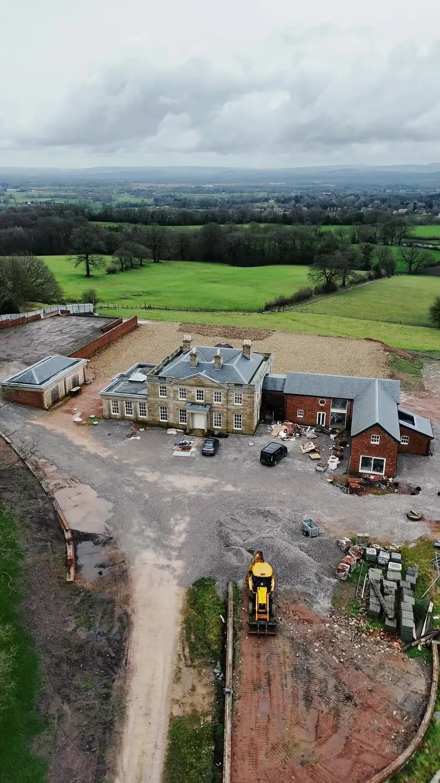 Drone view of a large house during renovation in Alderley Edge